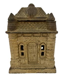 CAST IRON FOUR TOWER STILL BANK: CAST IRON FOUR TOWER STILL BANK MADE BY J&E STEVENS FROM 1895 UNTIL 1906. BANK MEASURES 4-1/4 WIDE BY 3-1/4 DEEP AND STANDS 5-3/4 INCHES TALL.
