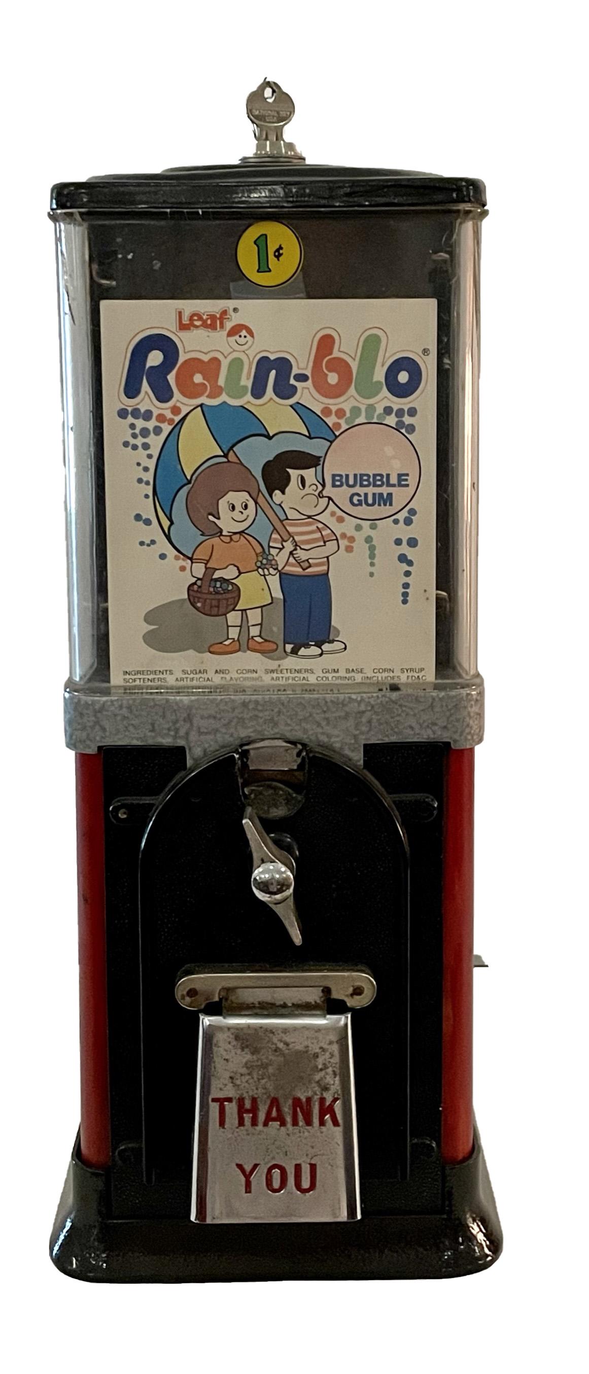 ONE CENT RAINBLO BUBBLE GUM COIN OP DISPENSER: ONE CENT RAINBLO BUBBLE GUM COIN OP DISPENSER MEASURES METAL BASE 17 INCHES TALL