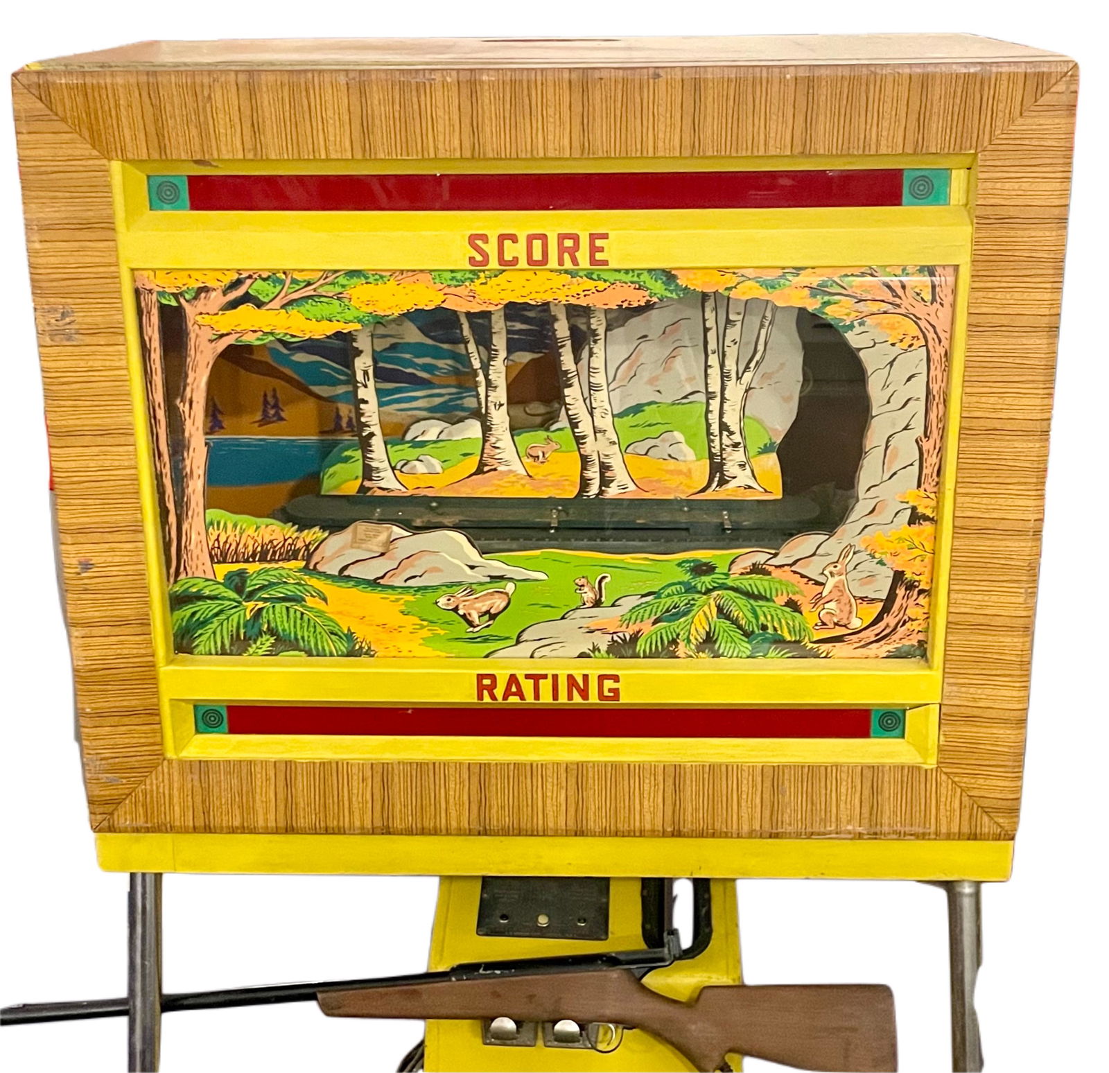 RAY-O-LITE RIFLE RANGE: SEEBURG SHOOT THE BEAR: ORIGINALLY DEVELOPED IN 1936 AS A DUCK HUNTING SHOOTING GALLERY GAME USING A LIGHT BEAM PHOTOCELL SYSTEM. THE JUKEBOX MANUFACTURER, SEEBURG PURCHASED THE COMPANY IN 1944 AND OFFERED 'COON HUNT' AND 'S