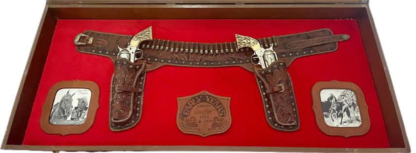 ROY ROGERS EARLY YEARS FERRELL'S OLE WEST MOVIE PROP: ROY ROGERS EARLY YEARS FERRELL'S OLE WEST MOVIE PROP 3 OF 500 OF A LIMITED SERIES HIG TOOLED LEATHER DOUBLE HOLSTER BELT WITH 1873 MODEL PROP WEAR DIMENSIONS OF SHOW CASE 46L X 19.5W X 4 DEPTH