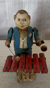 TIN AND CELLULOID WIND UP TOY