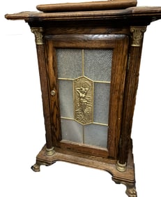 ANTIQUE OAK SLOT MACHINE STAND WITH DECORATIVE PANEL AND CLAW FEET
