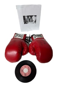 AUTOGRAPHED BOXING GLOVES AND 45 RECORD SIGNED BY MUHAMMAD ALI BORN CASSIUS MARCELLUS CLAY JR