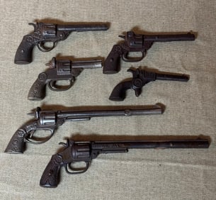 GROUP LOT OF CAST IRON CAP PISTOLS-BUFFALO BILL AND MORE