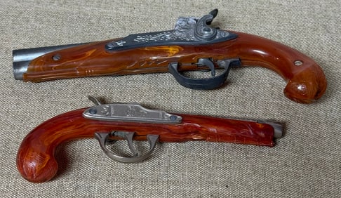 2 BAKELITE TOY FLINTLOCKS