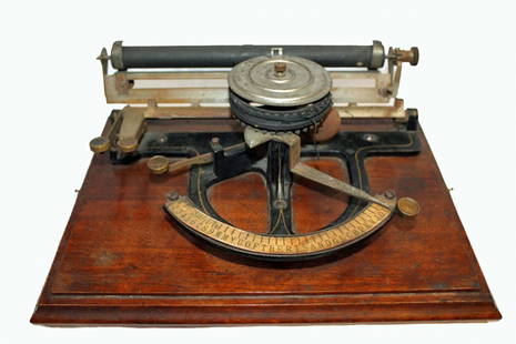 Early Typewriter: Early typewriter on wooden base. Very primitive and skeletal in appearance. Slide the arm to select a character and then depress side lever to print. Base 11 x 8.5."