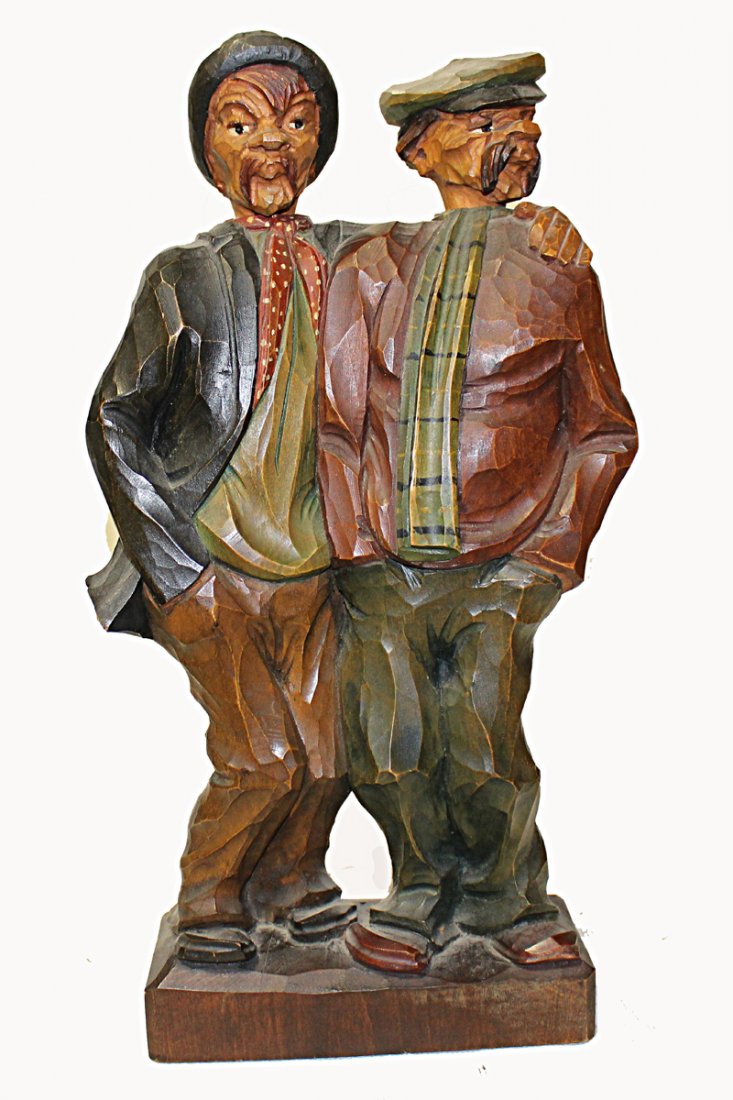 Pair of Whistlers: Two carved wooden whistlers standing side by side. Two winding mechanisms. One controls head movement from side to side. Other meach winds but currently produces no sound. Approximately 13" tall.