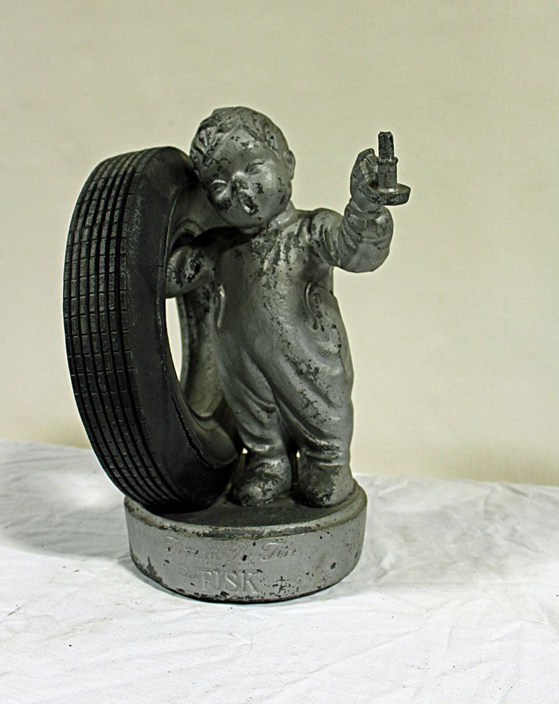 Fisk Tire Figure: Fisk Tire Boy with tire - It's Time to Retire - Buy Fisk. Wear to paint. Some splitting of tire close to rim. 15" tall.