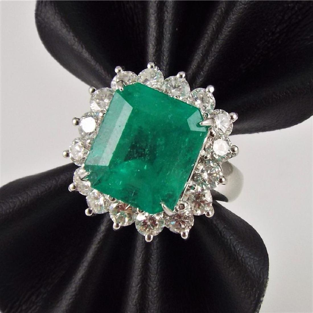 18K W.G. Dinner Ring w/8.0ct Emerald Cut Emerald: 18K W.G. Dinner Ring w/8.0ct Emerald Cut Emerald Surrounded By 2.0ctw Diamonds - Appr $18,750.00