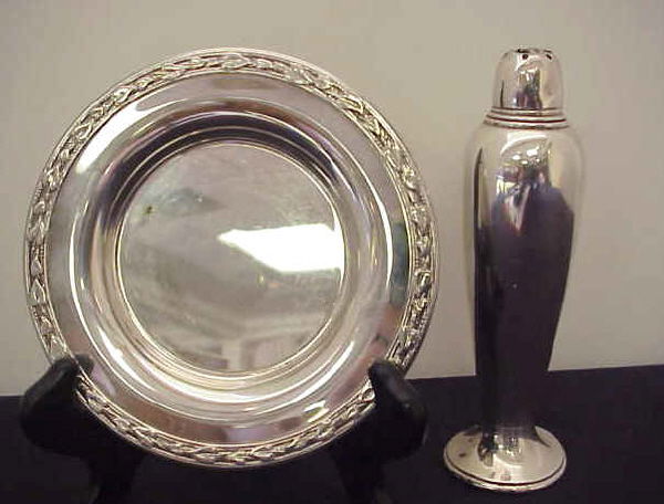 Gorham sterling silver and WM A Rogers silver.: "General Post Office, sterling silver sand dispenser imprinted Gorham Sterling Silver, circa 1890. H 6"" W 1 3/4"". note damage to top.WM A Rogers sterling silver plate. Dia 5 1/2"""