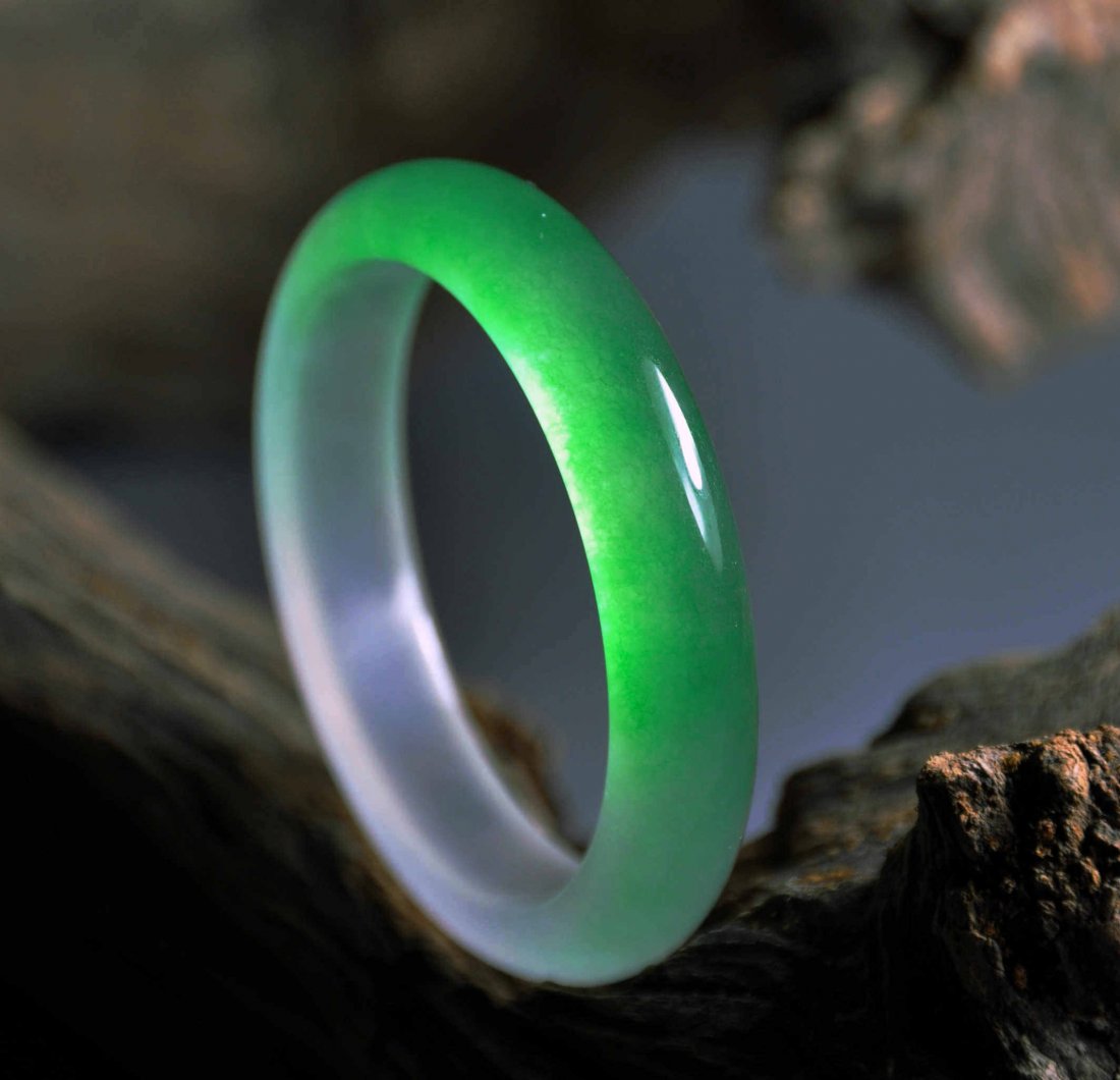 A translucent green and white jadeite bangle (1 of 4)