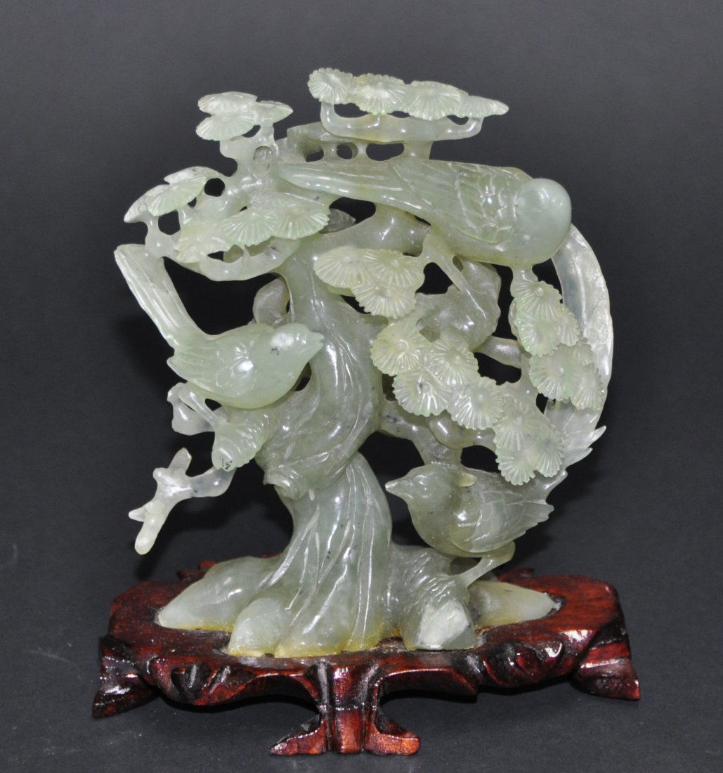 A green jade carving of a tree (1 of 6)