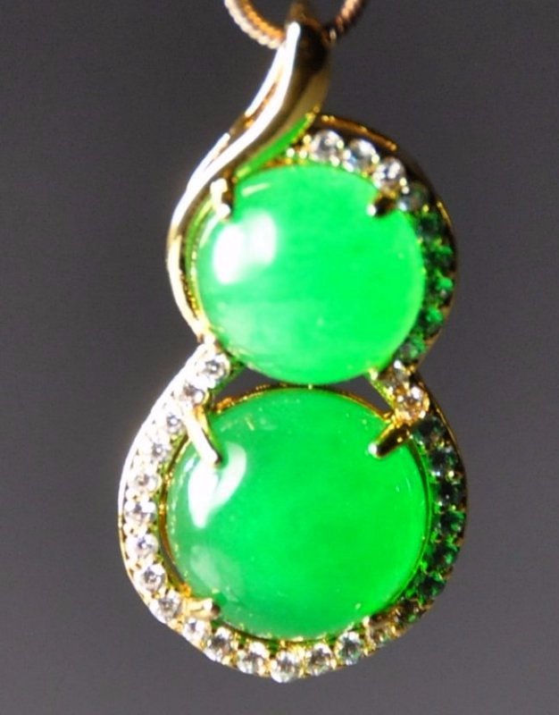 A translucent Double-ground jadeite pendant (1 of 4)