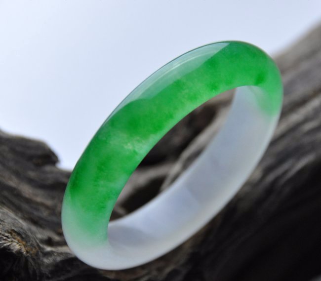 A translucent green and white jadeite bangle (1 of 4)
