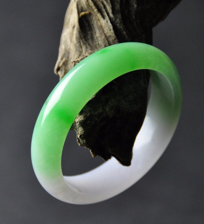 A translucent green and purple jadeite bangle (1 of 4)