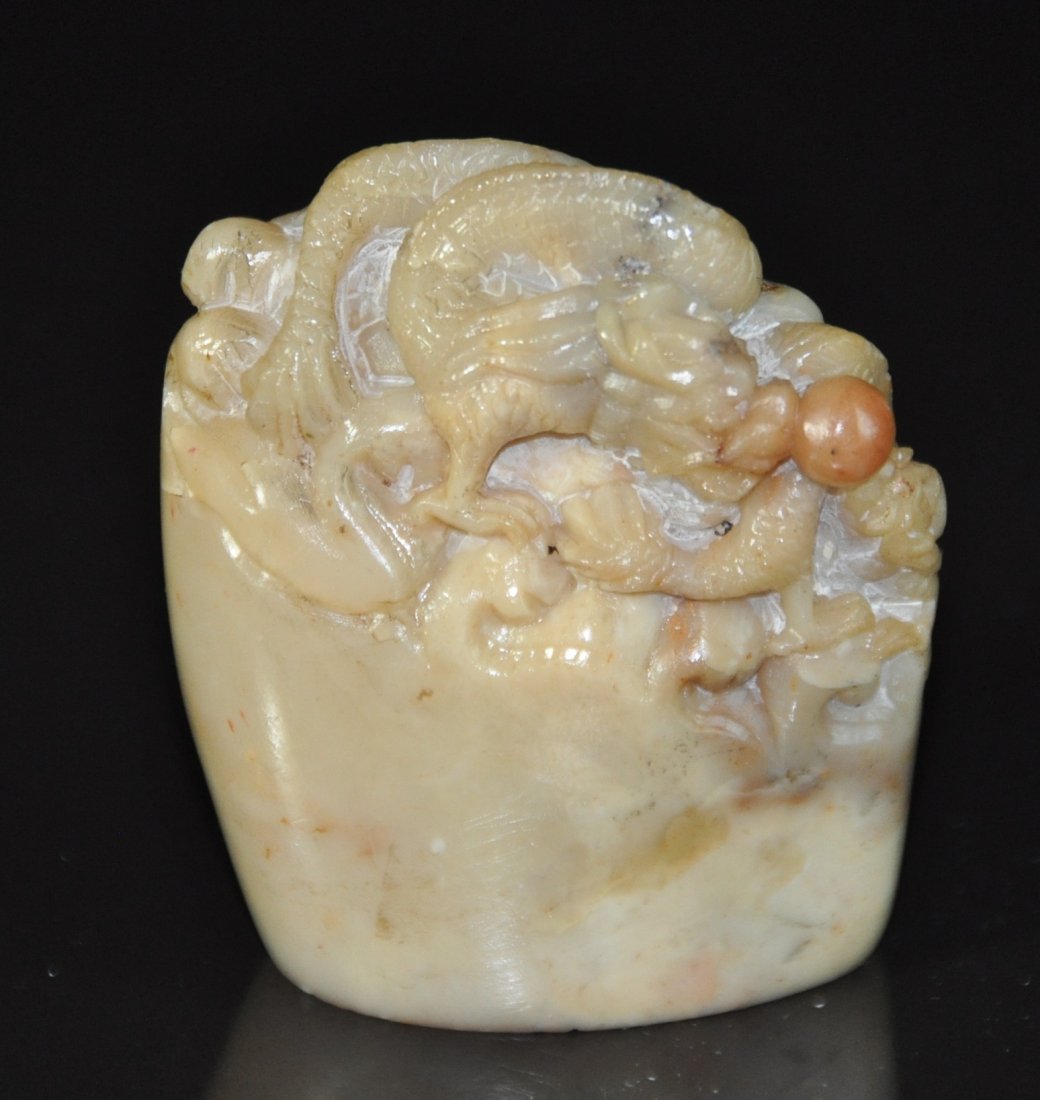 A soapstone caving dragon seal: A soapstone seal. Height 6.5 cm.