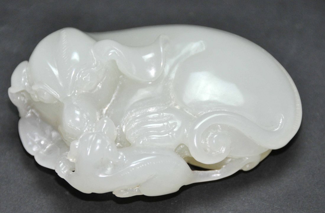 A fine Qing Dynasty Hetan carved white jade dog (1 of 5)
