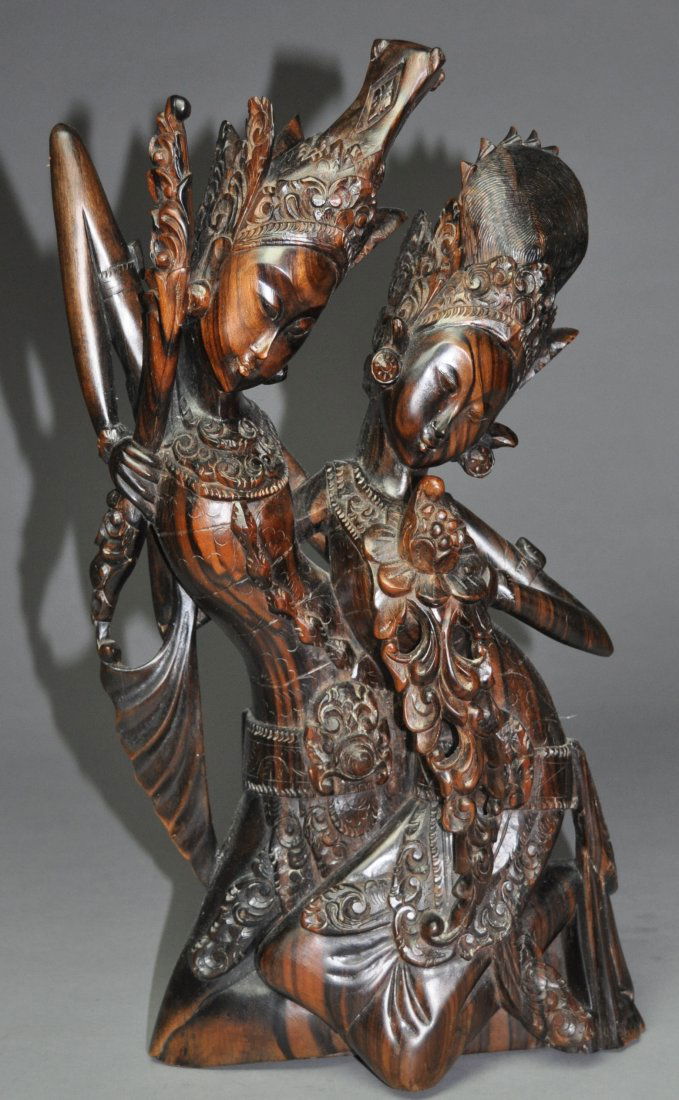 A Thailand Bali wooden carving of a figure: This piece is signed by A.A. Fatimah, Bali. A.A. Fatimah was renowned for his ebony sculptures, but also made use of other local hardwoods, such as sandalwood. because it is rare to find tribal art th
