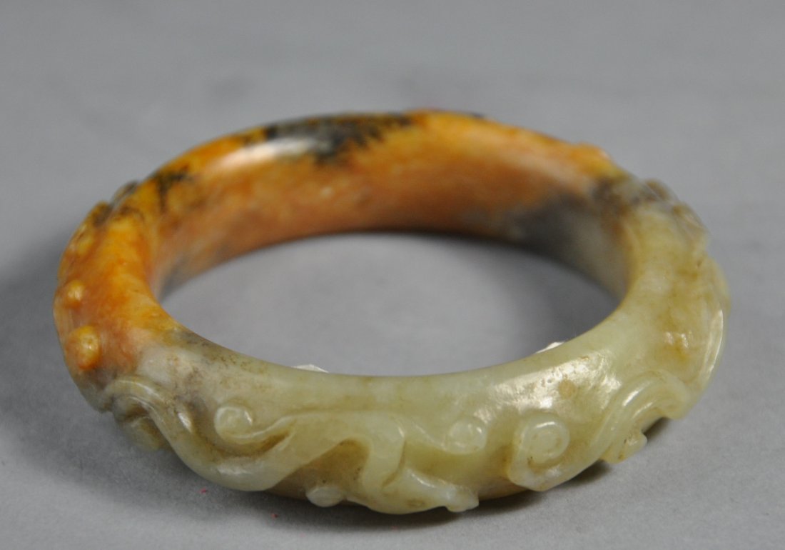 A fine Han Dynasty carved jade bangle (1 of 4)