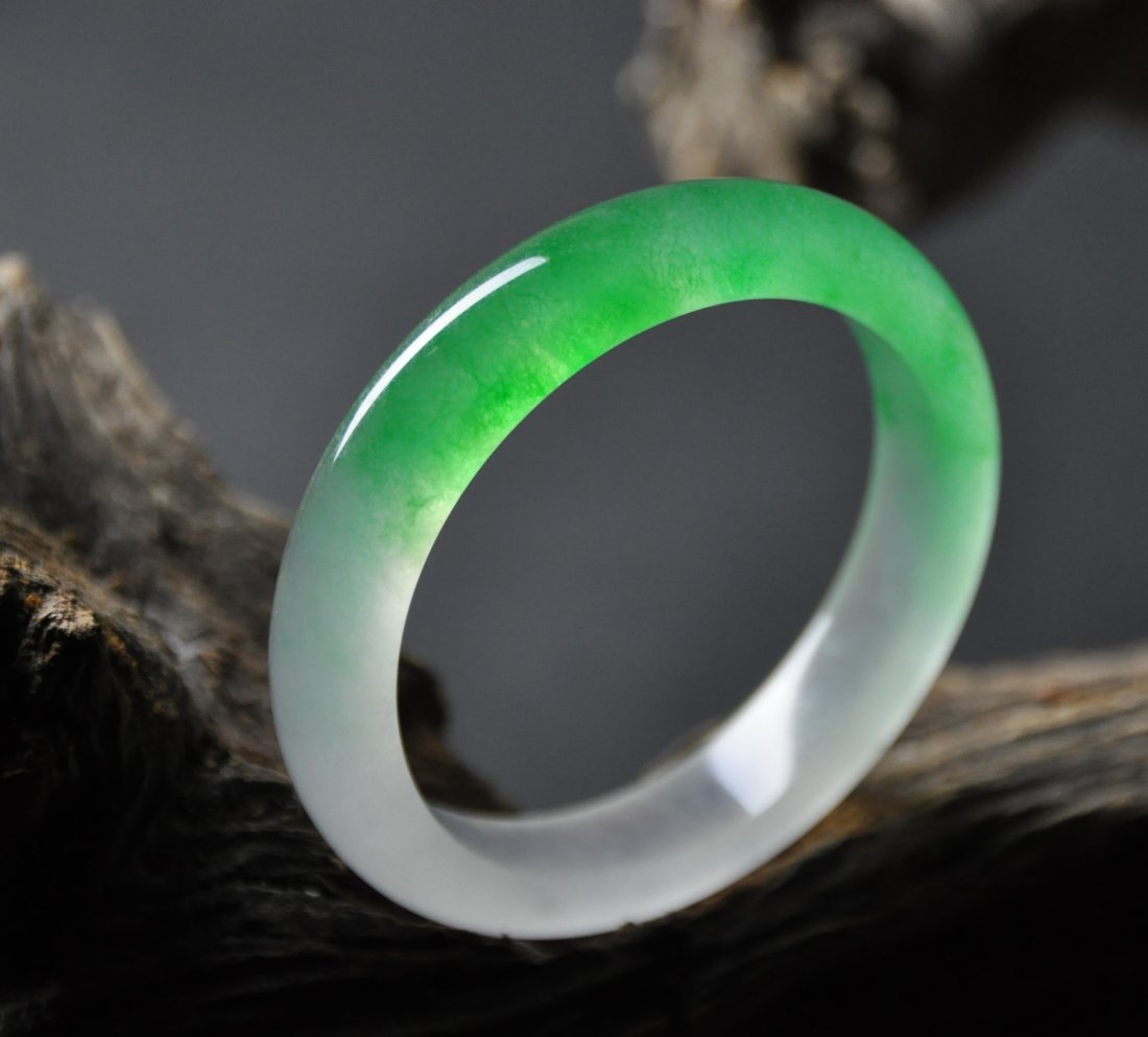 A translucent green and white jadeite bangle (1 of 5)