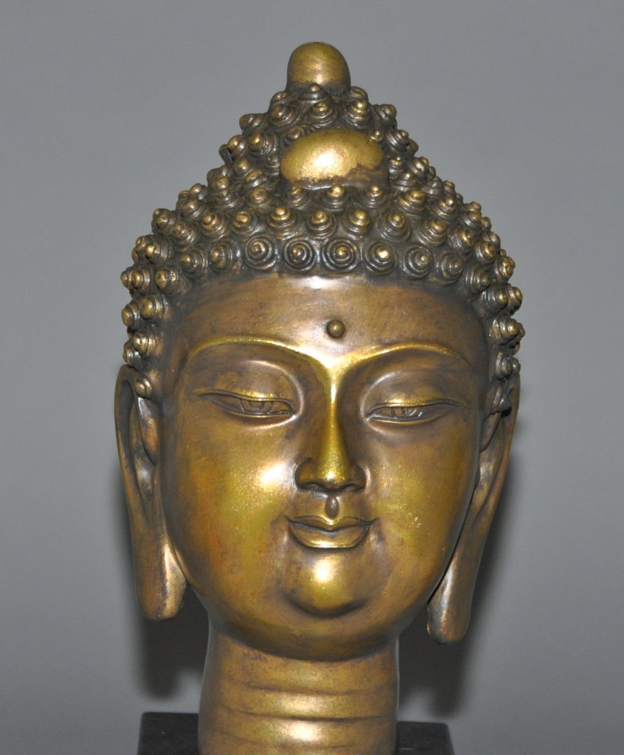 A Gilt- Bronze figure of the Buddha head (1 of 6)