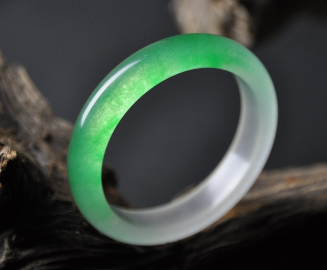A translucent green and white jadeite bangle (1 of 4)