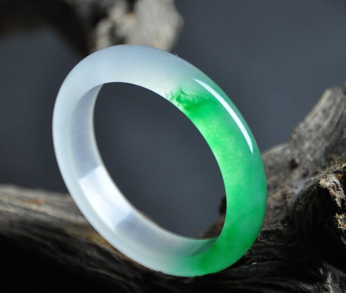 A translucent green and white jadeite bangle (1 of 5)