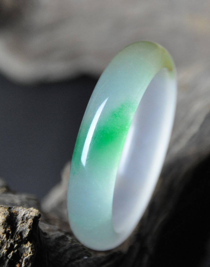 A translucent green and white jadeite bangle (1 of 5)