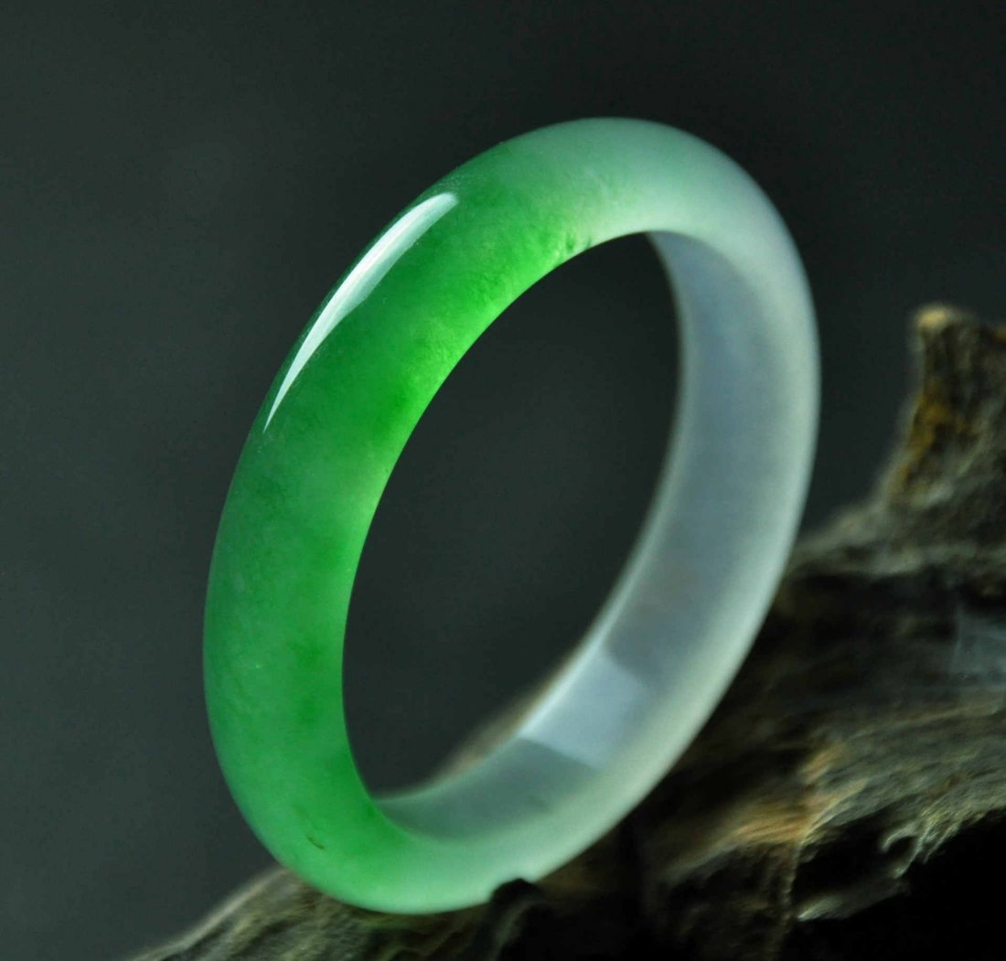 A translucent green and white jadeite bangle (1 of 7)