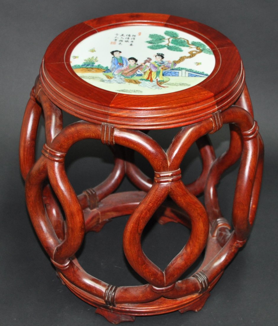 A Hongmu wood stool withfamille rose porcelain: A Hongmu wood stool withfamille rose porcelain. Height 46cm. Diameter 40cm. Diameter of Top 23cm.