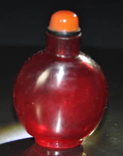 A fine 18th Century ruby-red glass snuff bottle: A fine 18th Century ruby-red glass snuff bottle. with stopper. Height 7.8cm.Provenance: Singapore private collectionMr Chen Hui Seng a retired entrepreneur and industrialist, is also an avid snuff