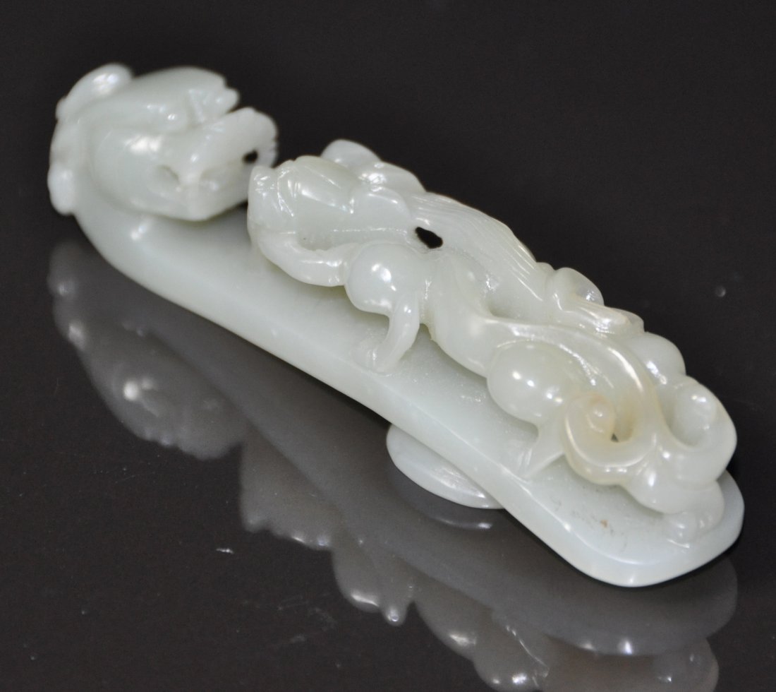 A Qing Dynasty  Hetian white jade belt hook (1 of 8)