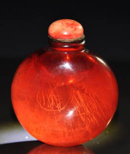 A fine 18th century ruby-red glass snuff bottle: A fine 18th century ruby-red glass snuff bottle. with coral stopper. Height 7.2cm. Provenance: Singapore private collection Mr Chen Hui Seng a retired entrepreneur and industrialist, is also an avid s