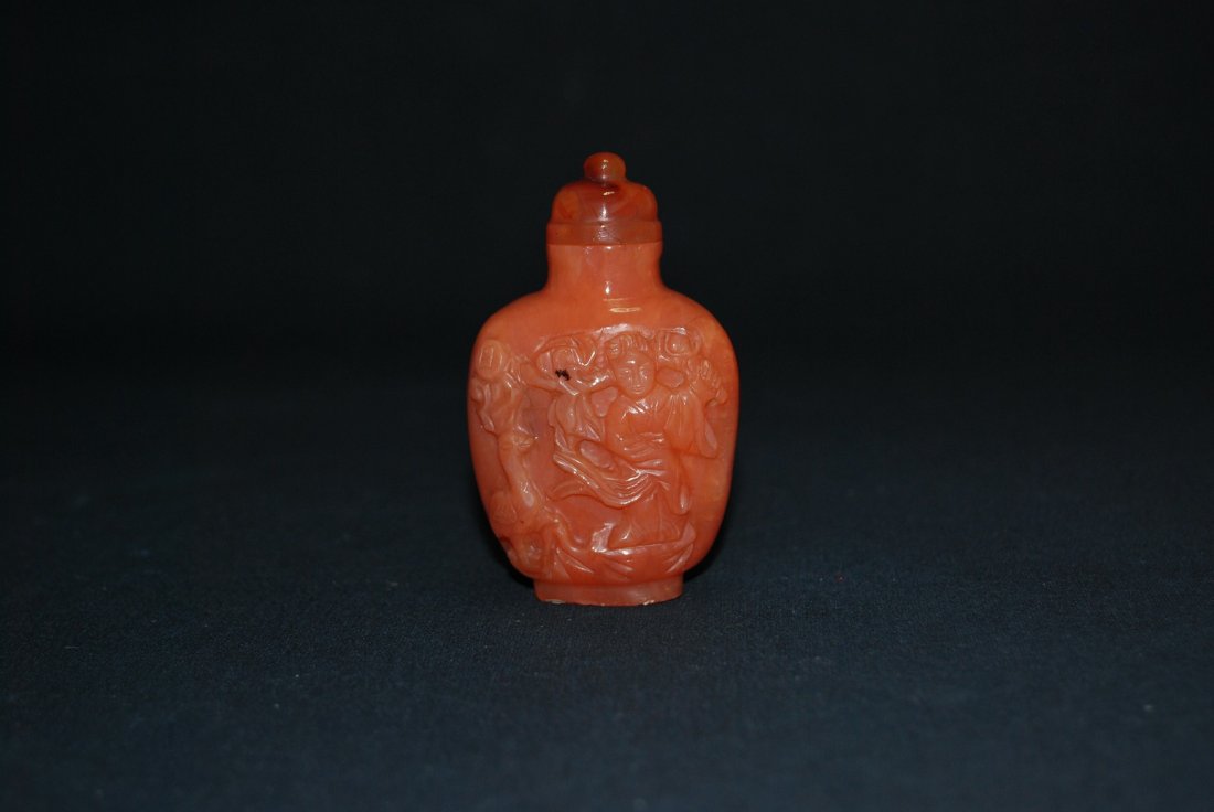 A Qing Dynasty red jadeite snuff bottle: A very rare red jadeite snuff bottle. It is very hard to find on today's markets. Height 8 cm