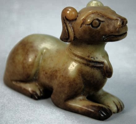 A Han dynasty Hetian Puppy: This exquisite carving, which is a masterpiece of Chinese Han Dynasty. It was carved by knife. This piece was auctioned in London's Bonhams auction. Length 4 in, Height 2.8 in