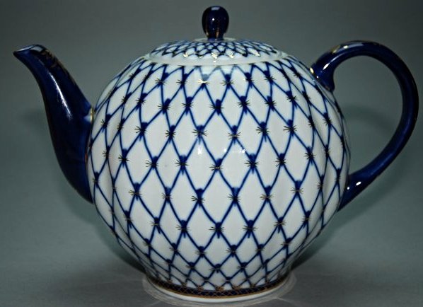 An 18th century Chinese export kettle: This piece is very beautiful and features and lattice pattern with gilded designs. Height 7.9 in