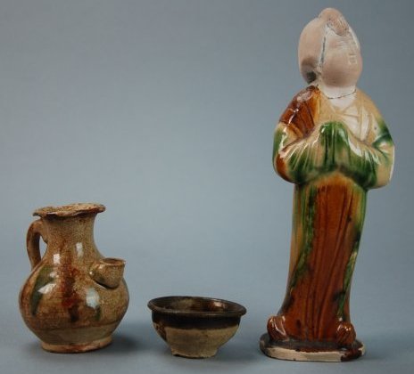 A lot of three Tang San Cai figures and cup: This pieces are very unusual, they are three colors: green, brown and red. There is a figure, a kettle and a tea cup. Height of figure 8 in, Height of teacup 1.2 in, Height of kettle 3.5 in