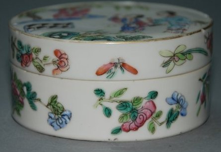 A Qing Dynasty famille box: Jiaqing marker and of the period This piece is very beautiful. There flowers, butterflies and figures drawn delicately onto this porcelain box. Provenance: A British private collection Diameter 3.2 in