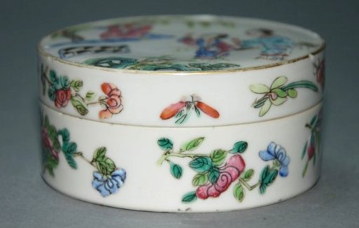 A Qing Dynasty famille box: Jiaqing marker and of the period This piece is very beautiful. There flowers, butterflies and figures drawn delicately onto this porcelain box. Provenance: A British private collection Diameter 3.2 in