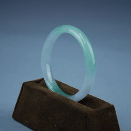 A translucent white and green jadeite bangle bracelet (1 of 5)