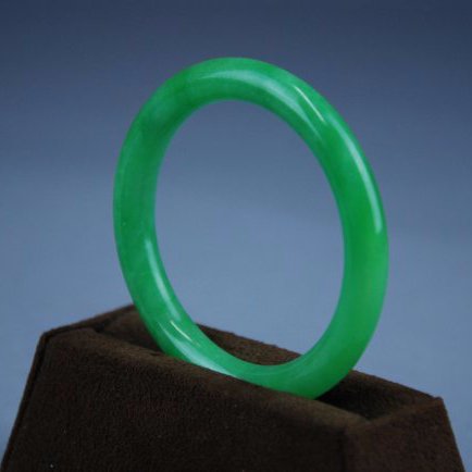 A very rare     green jadeite bangle (1 of 7)