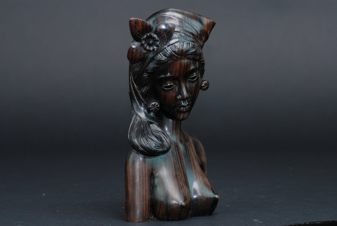 An antique Thailand Bali hard wood figure carving: This piece is carved by the renouned artist Wayansamb. This piece depicts an exquisite realistic carving of a woman. There are additional markers indicated at the bottom of this piece. Height 8.5 in
