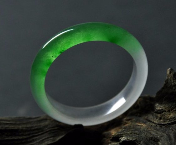 A translucent green and white jadeite bangle (1 of 5)