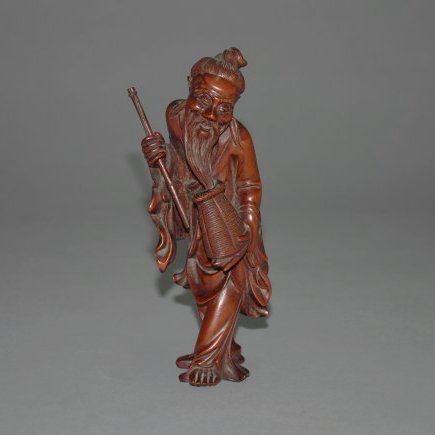 A Qing dynasty carved boxwood figure (1 of 4)