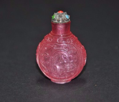 A rare Qing Dynasty Chinese carved pink glass snuff (1 of 10)