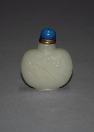 A Qing Dynasty carved white jade snuff bottle (1 of 5)