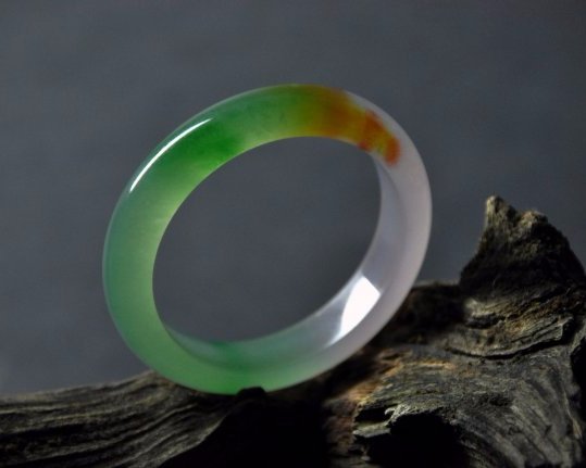 A translucent green and white jadeite bangle (1 of 5)