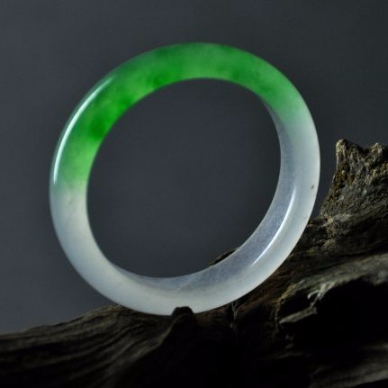 A translucent green and white jadeite bangle (1 of 4)