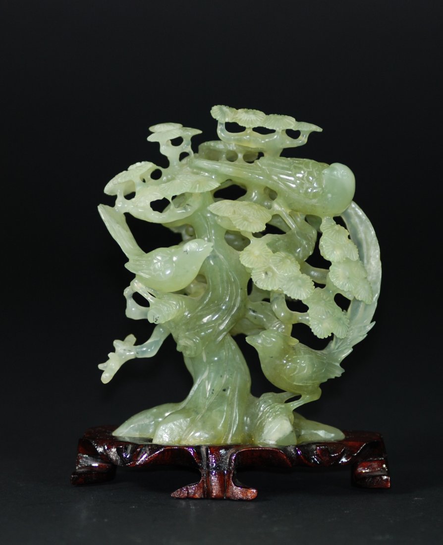 A green jade carving of a tree (1 of 5)