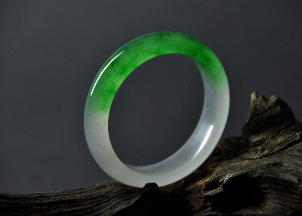 A translucent green and white jadeite bangle (1 of 5)